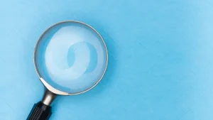 Magnifying glass on a blue background