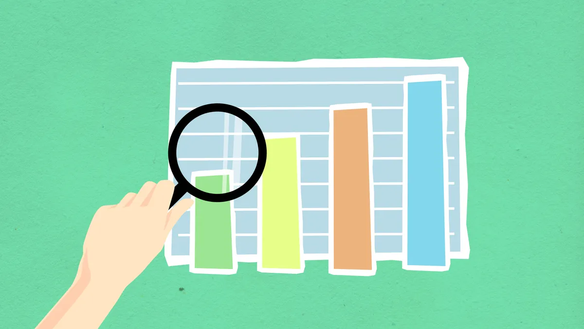 magnifying glass over bar chart