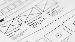 Website wireframe sketches on paper